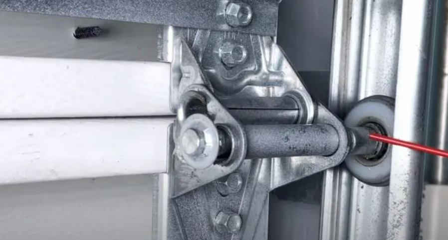 Professional technician fixing a noisy garage door in Weston, FL for optimal performance