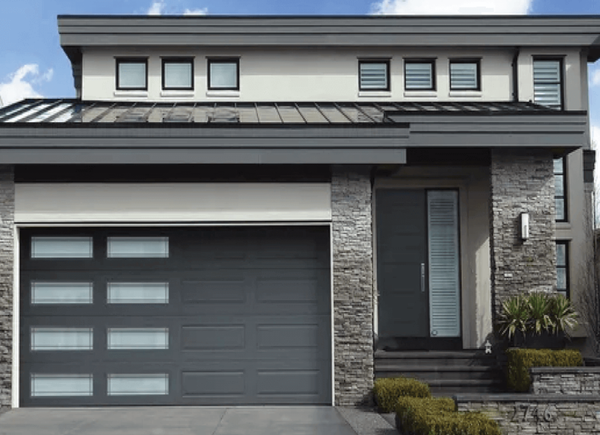 A professional technician from Garage Door Repair Services Weston FL performing a same-day garage door repair on a residential property.