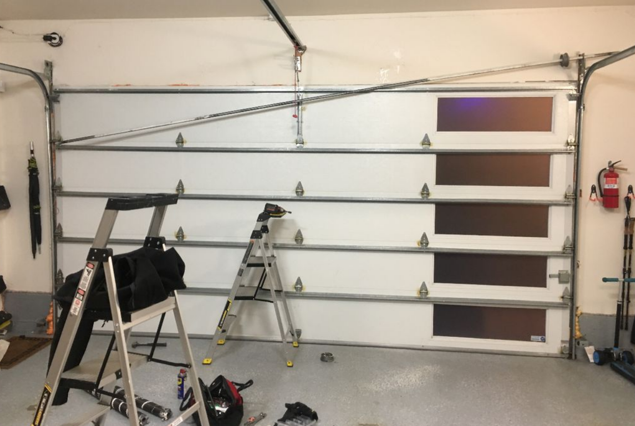 Professional garage door installation service in Weston FL - Expert technicians installing a new garage door for enhanced security and curb appeal.