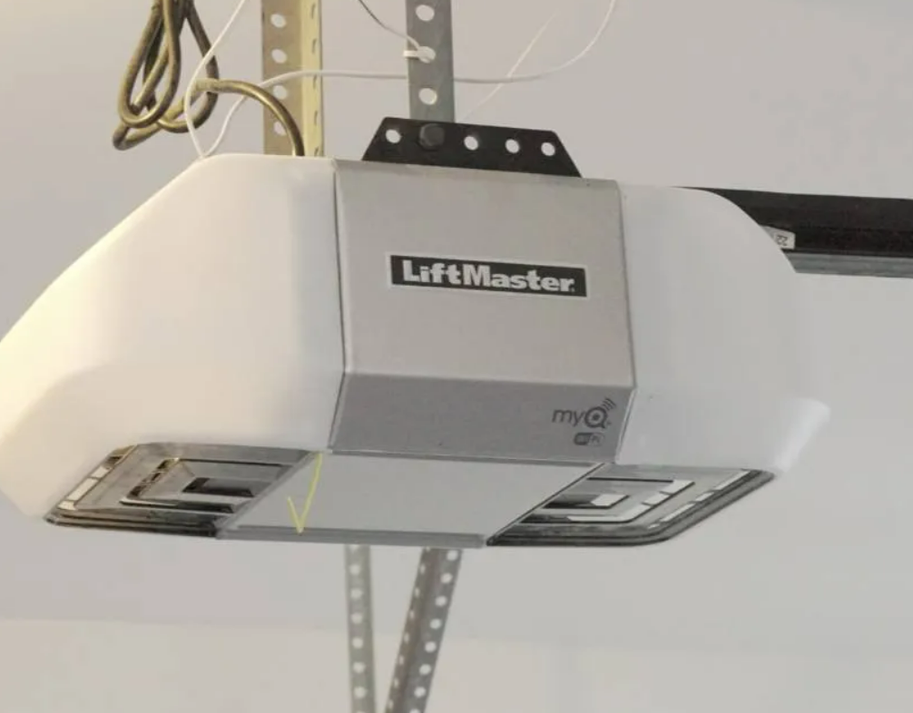 Professional garage door opener installation in Weston, FL showcasing a skilled technician installing a modern garage door opener system in a residential setting.