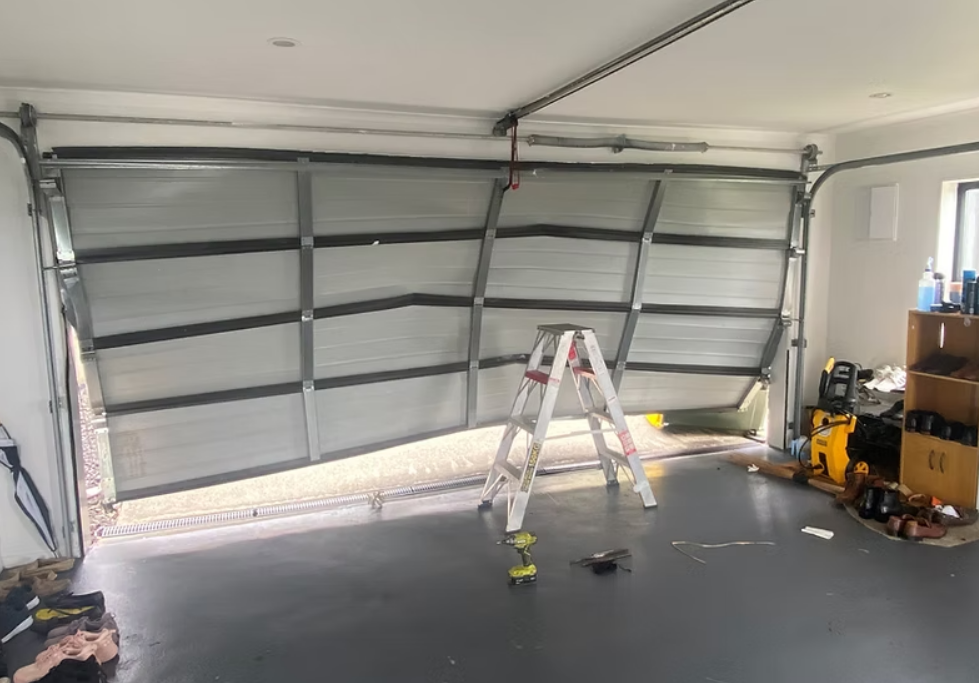 Close-up image of a technician performing garage door section replacement in Weston, FL, highlighting professional tools and equipment used for efficient repair services.