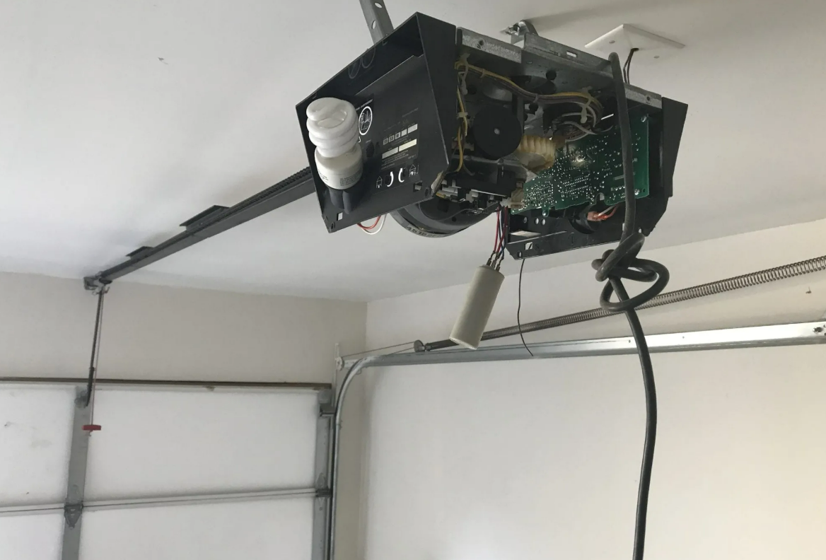 A professional technician repairing a garage door opener in Weston, FL, highlighting our expert garage door opener repair services.